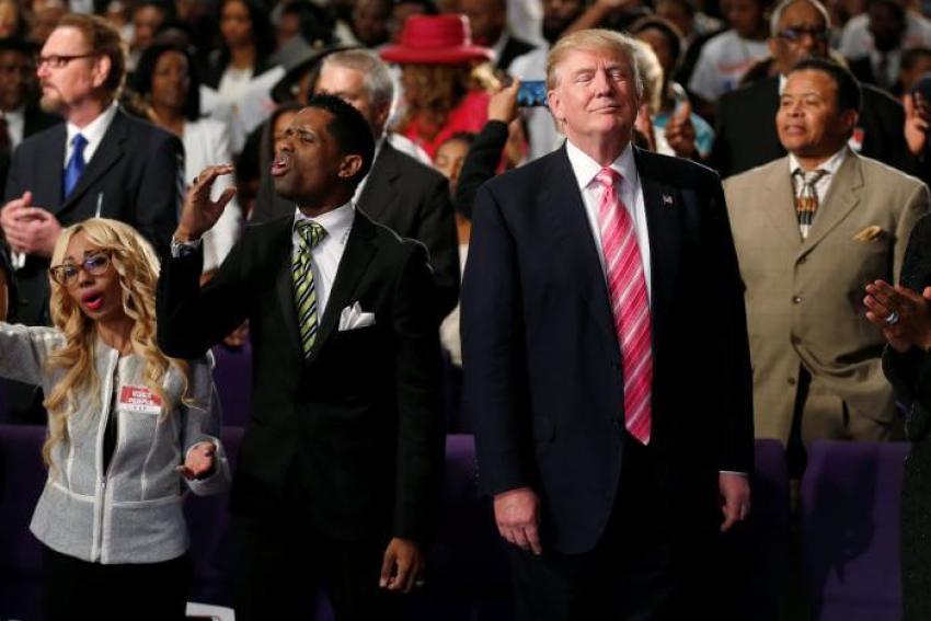 Republican presidential nominee Donald Trump attends a church service, in Detroit, Michigan, U.S., September 3, 2016.
