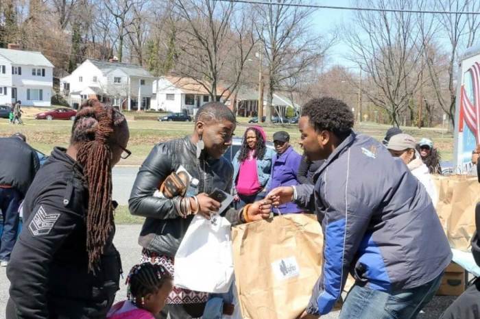 Pastor Bobby Manning of First Baptist Church of District Heights, a suburb of Maryland, is seen handing out groceries to community residents in this undated photo.