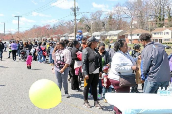 Pastor Bobby Manning of First Baptist Church of District Heights, a suburb of Maryland, is seen distributing groceries to a long line of community residents in this undated photo.