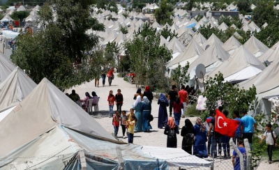 Syrian refugees stroll at a refugee camp in Osmaniye, Turkey, May 17, 2016.