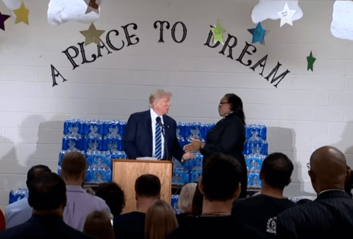 Republican presidential nominee, Donald Trump (L) is rebuked by Pastor Faith Green Timmons of the Bethel United Methodist in Flint, Michigan for attacking Democratic presidential nominee, Hillary Clinton on Wednesday September 14, 2016.