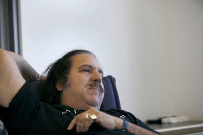 Adult film star Ron Jeremy pauses during an interview with Reuters in New York February 7, 2007. Porn star Jeremy wants to be taken seriously with his clothes on, with his new found mainstream appeal from reality television.