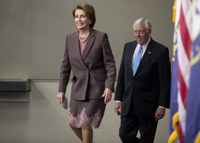 House Minority Leader Nancy Pelosi (D-CA) and House Minority Whip Steny Hoyer (D-MD) arrive for a press conference after the House Democrats voted for their leadership on Capitol Hill in Washington November 18, 2014.