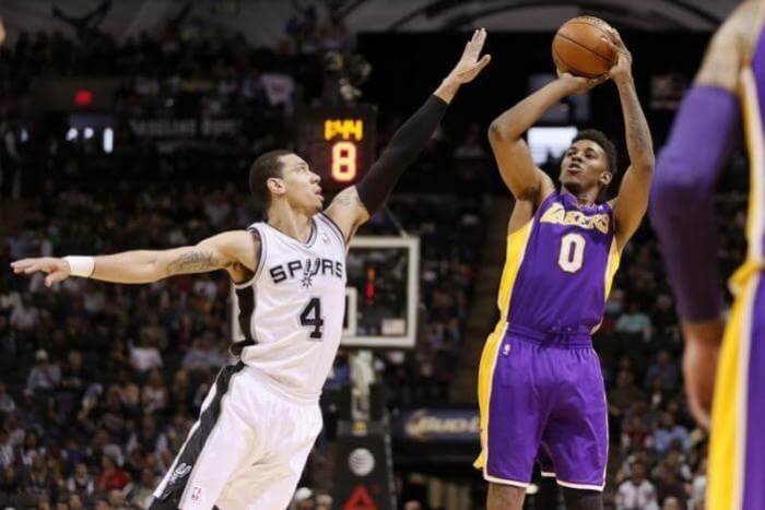 Lakers SF Nick Young shoots over Spurs SG Danny Green during 2014 game.