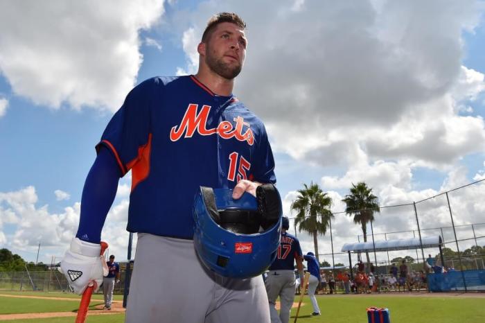 New York Mets outfielder Tim Tebow (15) walks to the dugout after hitting during his workout at the Mets Minor League Complex in Port St. Lucie, Florida, September 19, 2016.