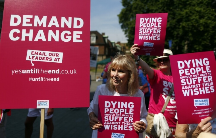 Actress Susan Hampshire joins supporters of a bill legalising assisted dying holding placards outside Parliament in Westminster, central London, July 18, 2014.