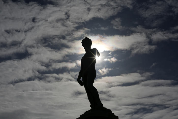 A copy of Michelangelo's David is silhouetted in Florence, Italy March 1, 2016.