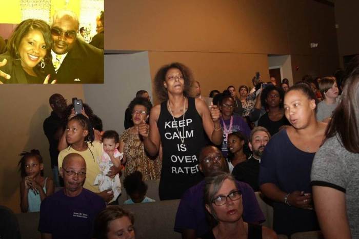 Tulsa community members grieve the death of Terence Crutcher (inset) at a vigil held at the Metropolitan Baptist Church on Wednesday September 21, 2016. Crutcher was gunned down by Tulsa police last Friday after his SUV broke down in the street.