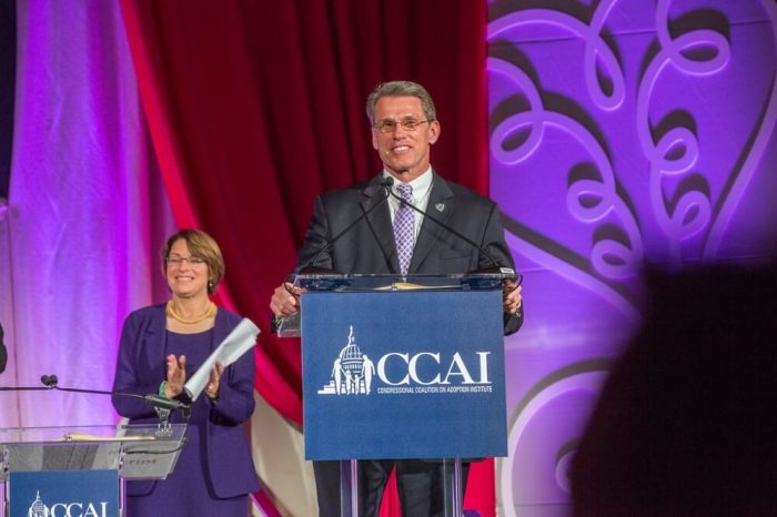 Minnesota Vikings General Manager Rick Spielman receives the Angels In Adoption Award at the CCAI gala banquet in Washington, D.C. Sept. 22, 2016. US Senator Amy Klobuchar from Minnesota (D) stands to the left.