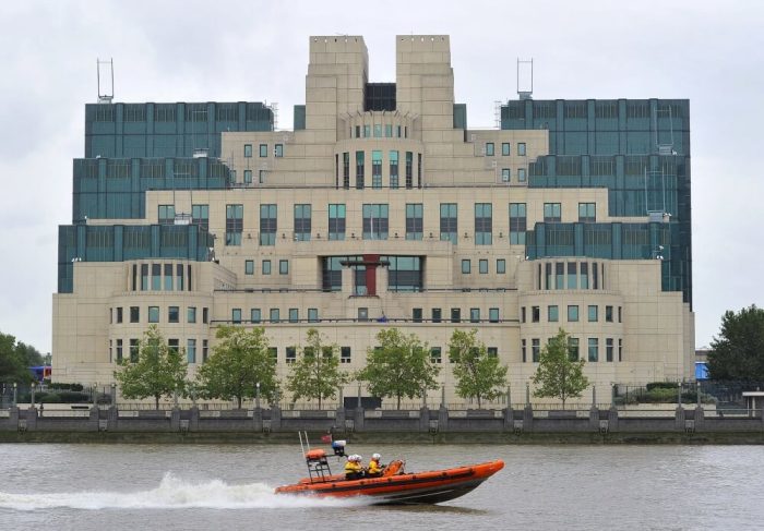A motorboat passes by the MI6 building in London on August 25, 2010.