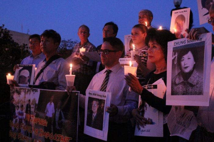 Activists protest in a candlelight vigil honoring the North Korean defectors and human rights activists who have died or been imprisoned thanks to Chinese repatriation policy at the Chinese Embassy in Washington, D.C. on Sept. 23, 2016.