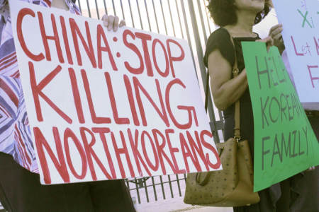 North Korea human rights activists protest outside the Chinese embassy in Washington, D.C. on Save North Koreans Day, Sept. 23, 2016.