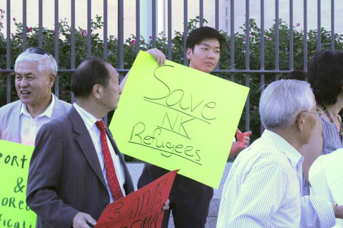 North Korea human rights activists protest outside the Chinese embassy in Washington, D.C. on Save North Koreans Day, Sept. 23, 2016.