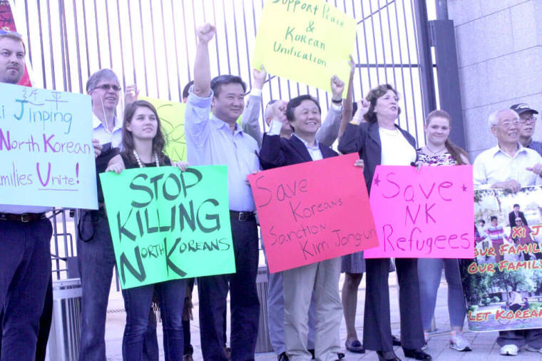 Activists protest outside the Chinese Embassy in Washington, D.C. on Sept. 23, 2016.