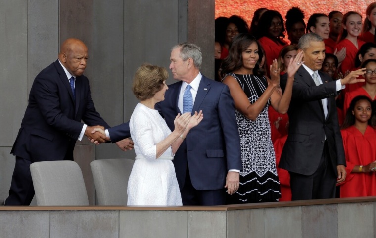 Former U.S. President George W. Bush greets Rep. John Lewis (D-Ga.) as U.S. President Barack Obama, U.S. first lady Michelle Obama and former first lady Laura Bush arrive for the dedication of the Smithsonian’s National Museum of African American History and Culture in Washington, U.S., September 24, 2016.