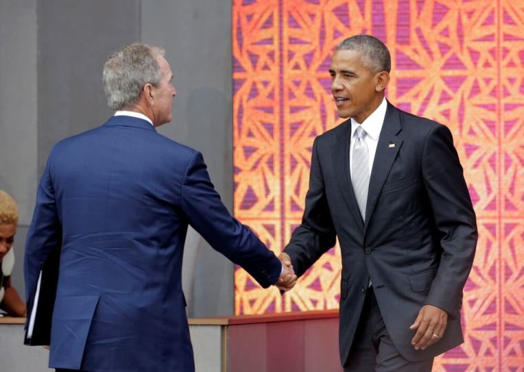 U.S. President Barack Obama shakes hands with former U.S. President George W. Bush during dedication of the Smithsonian’s National Museum of African American History and Culture in Washington, U.S., September 24, 2016.