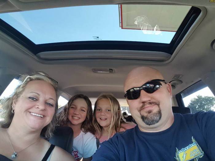 Greg, 40, and Sarah Moyers, 39, along with their two daughters.