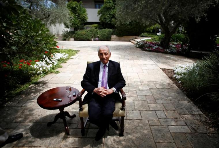 Israel's President Shimon Peres speaks during an interview with Reuters at his residence in Jerusalem in this June 16, 2013, file photo.