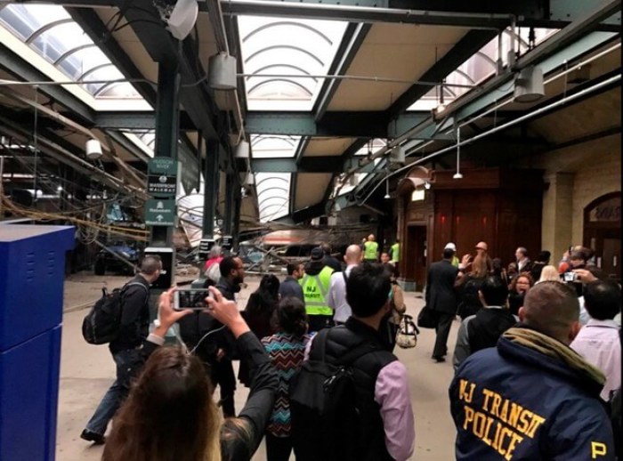 Onlookers view a New Jersey Transit train that derailed and crashed through the station in Hoboken, New Jersey, U.S. in this picture courtesy of David Richman taken September 29, 2016.