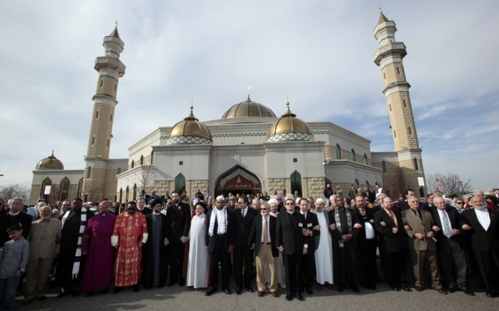A group of interdenominational religious leaders and their supporters gather outside the Islamic Center of America mosque to rally for peace in Dearborn, Michigan, April 21, 2011.