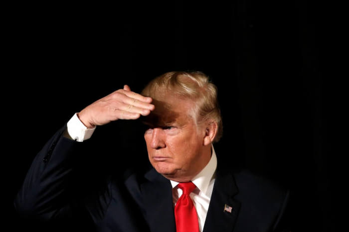 Republican presidential nominee Donald Trump listens to a question as he appears at the 'Retired American Warriors' conference during a campaign stop in Herndon, Virginia, U.S., October 3, 2016.