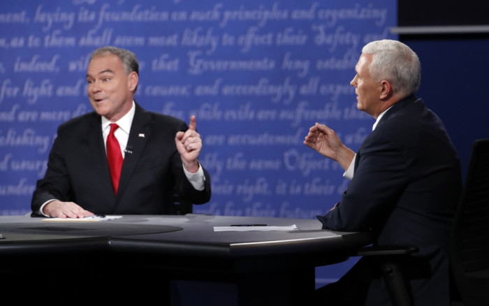 Tim Kaine and Mike Pence discuss an issue during their vice presidential debate at Longwood University in Farmville, Virginia.