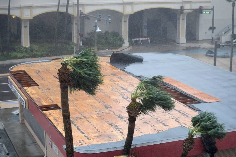 Part of the roof of a business peels away as the eye of Hurricane Matthew passes Daytona Beach, Florida, October 7, 2016.
