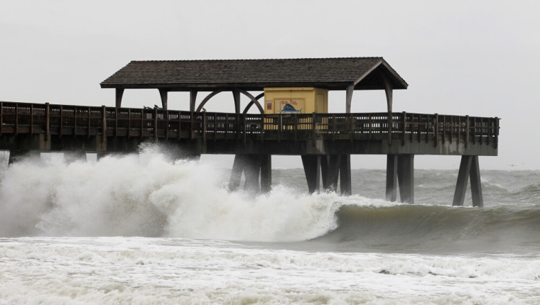 Waves pound the pier as Hurricane Matthew approaches on Tybee Island, Georgia, October 7, 2016.