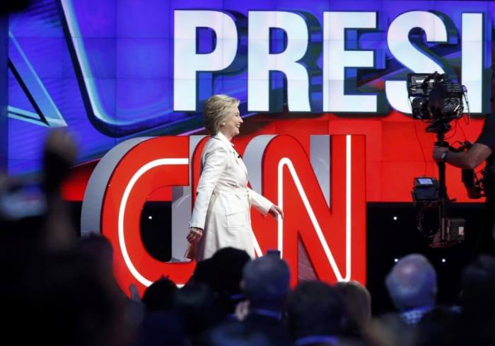 Democratic U.S. presidential candidate Hillary Clinton arrives to attend a Democratic debate hosted by CNN and New York One at the Brooklyn Navy Yard in New York April 14, 2016.