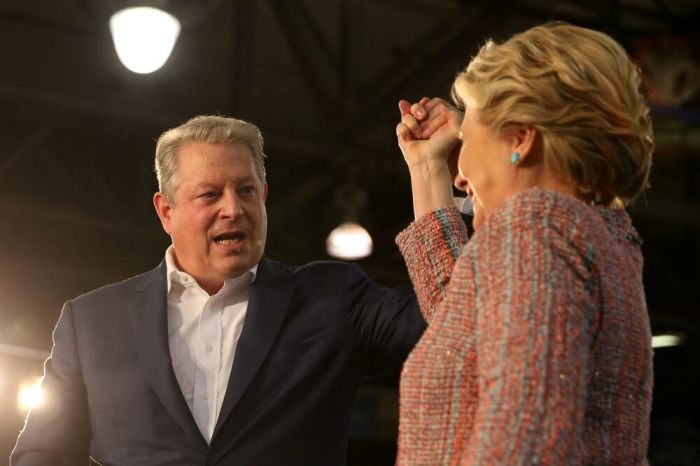 U.S. Democratic presidential nominee Hillary Clinton (R) and former Vice President Al Gore shake hands after talking about climate change at a rally at Miami Dade College in Miami, Florida, U.S. October 11, 2016.