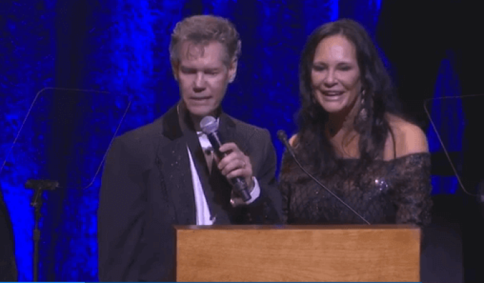 Randy Travis sings 'Amazing Grace' standing next to his wife Mary Davis-Travis at Country Music Hall of Fame, Nashville, Tennessee, October 16, 2016.