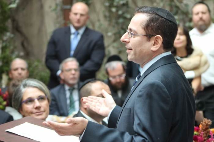 Rabbi Gideon Shloush, president of The New York Board of Rabbis and spiritual leader at the Congregation Adereth-El speaks at the Sukkah in the Sky event at the Edmund J. Safra Synagogue in New York City on October 20, 2016.