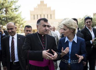 German Defence Minister Ursula von der Leyen (R) and Iraqi Archbishop Bashar Warda (C) the Chaldean Archbishop of Arbil, visit St. Josef Kirche in Ankawa near Arbil north of Baghdad September 25, 2014.