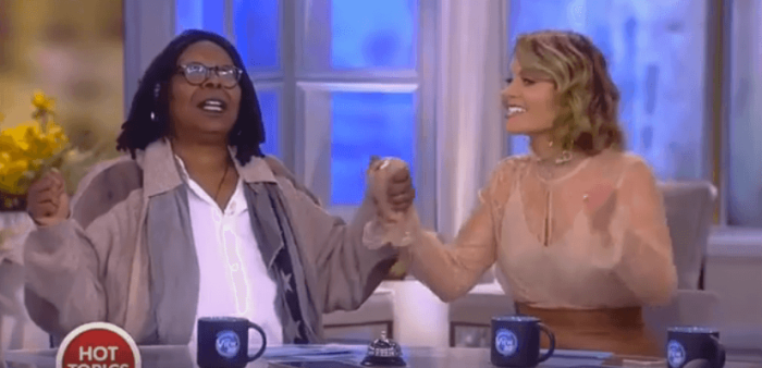 Whoopi Goldberg and Candace Cameron Bure hold hands and pray on on 'The View,' October 26, 2016.