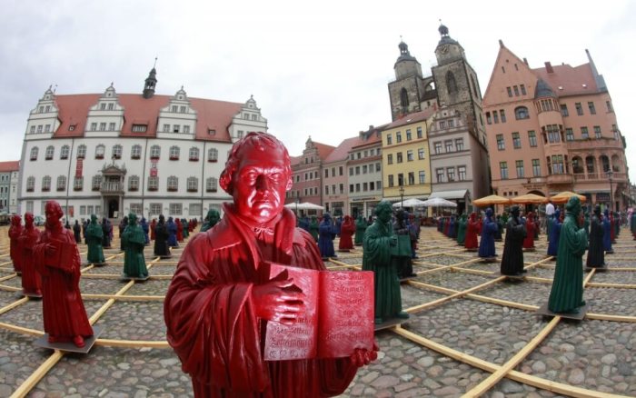 Plastic statuettes of 16th-century Protestant reformer Martin Luther, which are part of the art installation 'Martin Luther - I'm standing here' by German artist Ottmar Hoerl, are pictured in the main square in Wittenberg, eastern Germany, August 11, 2010.