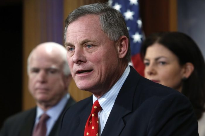 U.S. Senator Richard Burr (R-NC) (C), flanked by Senator John McCain (R-AZ) (L) and Senator Kelly Ayotte (R-NH) (R), speaks at a news conference to talk about new legislation to restrict prisoner transfers from the detention center at Guantanamo Bay, at the U.S. Capitol in Washington, D.C. on January 13, 2015.
