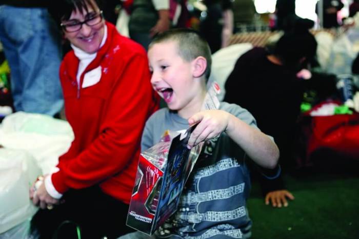 A child shows joy after receiving a Christmas gift donated by a volunteer through Prison Fellowship's Angel Tree Christmas program in this undated file photo.