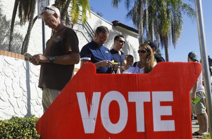 Voters head to the polls during the U.S. presidential election in St. Petersburg, Florida, November 8, 2016.