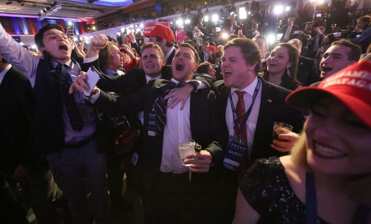 Supporters of U.S. Republican presidential nominee Donald Trump react at his election night rally in Manhattan, New York, November 8, 2016.