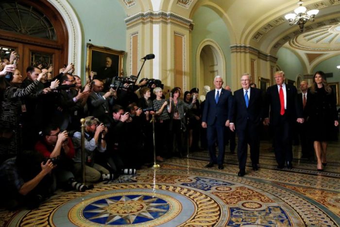 U.S. President-elect Trump (2nd R), his wife Melania Trump (R), Vice President-elect Mike Pence (4th R) and Senate Majority Leader Mitch McConnell (R-KY) (3rd R) walk together to meet in McConnell's office at the U.S. Capitol in Washington, U.S. November 10, 2016.