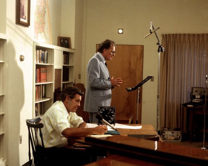 Cliff Barrows (L) in a recording studio with Billy Graham as he directed The Hour of Decision radio show.