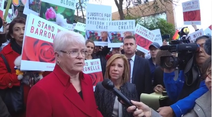 Barronelle Stutzman, surrounded by supporters, speaks with the media after appearing for the Washington Supreme Court at Bellevue College on Nov. 15, 2016.