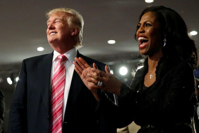 Republican presidential nominee Donald Trump and Omarosa Manigault (R) attend a church service, in Detroit, Michigan, September 3 2016.