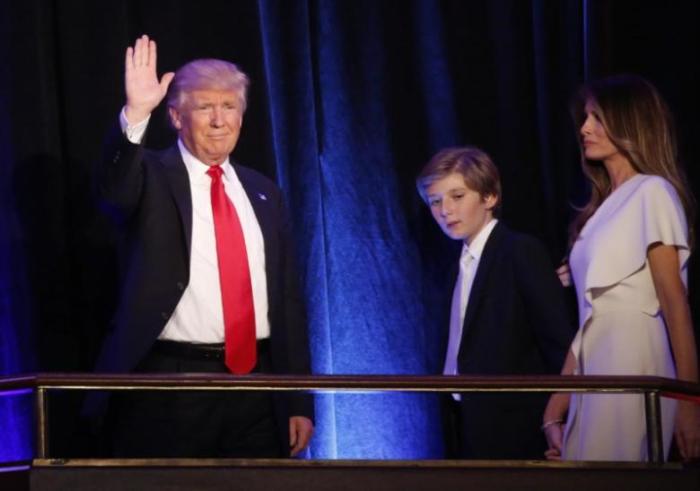 U.S. Republican presidential nominee Donald Trump arrives to speak at his election night rally with his son Barron and wife Melania in Manhattan, New York, U.S., November 9, 2016.