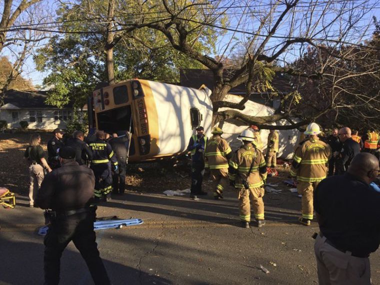 Rescue officials at the scene of a school bus crash involving several fatalities in Chattanooga, Tennessee, November 21, 2016.