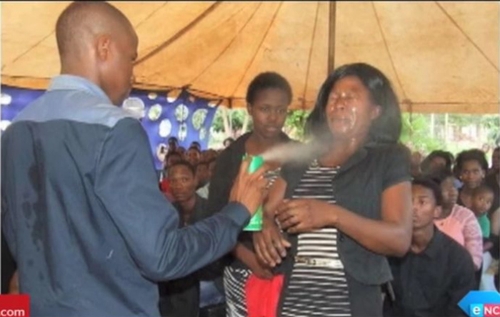 Pastor Lethebo Rabalago of Mount Zion General Assembly in the Limpopo province in South Africa spraying 'Doom' in this undated photo.
