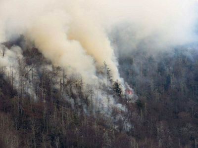 Smoke plumes from wildfires are shown in the Great Smokey Mountains near Gatlinburg, Tennessee, November 28, 2016.