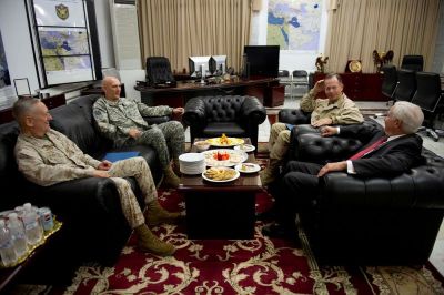 Outgoing Commander of U.S. Forces in Iraq General Raymond Odierno (2nd L) speaks with Commander of U.S. Central Command General James Mattis (L), U.S. Defense Defense Robert Gates (R) and Chairman of the Joint Chiefs of Staff Admiral Mike Mullen (2nd R) during a meeting in Baghdad on September 1, 2010.