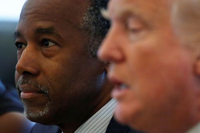 Ben Carson (L) and Republican presidential then nominee Donald Trump speak during a round table with the Republican Leadership Initiative at Trump Tower in the Manhattan borough of New York, August 25, 2016.