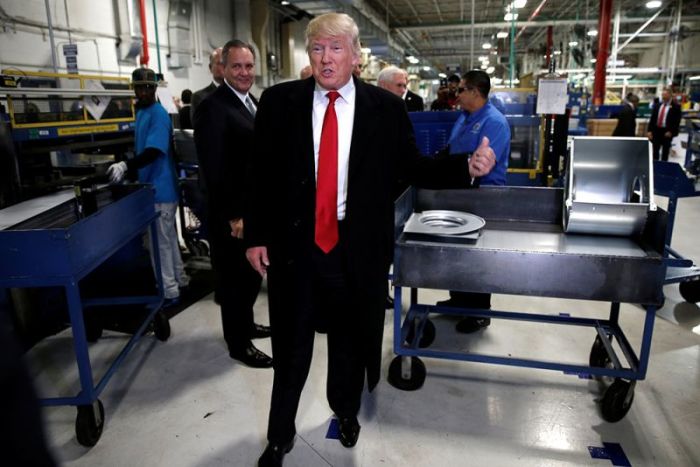 U.S. President-elect Donald Trump speaks to members of the news media as he tours a Carrier factory in Indianapolis, Indiana, U.S., December 1, 2016.